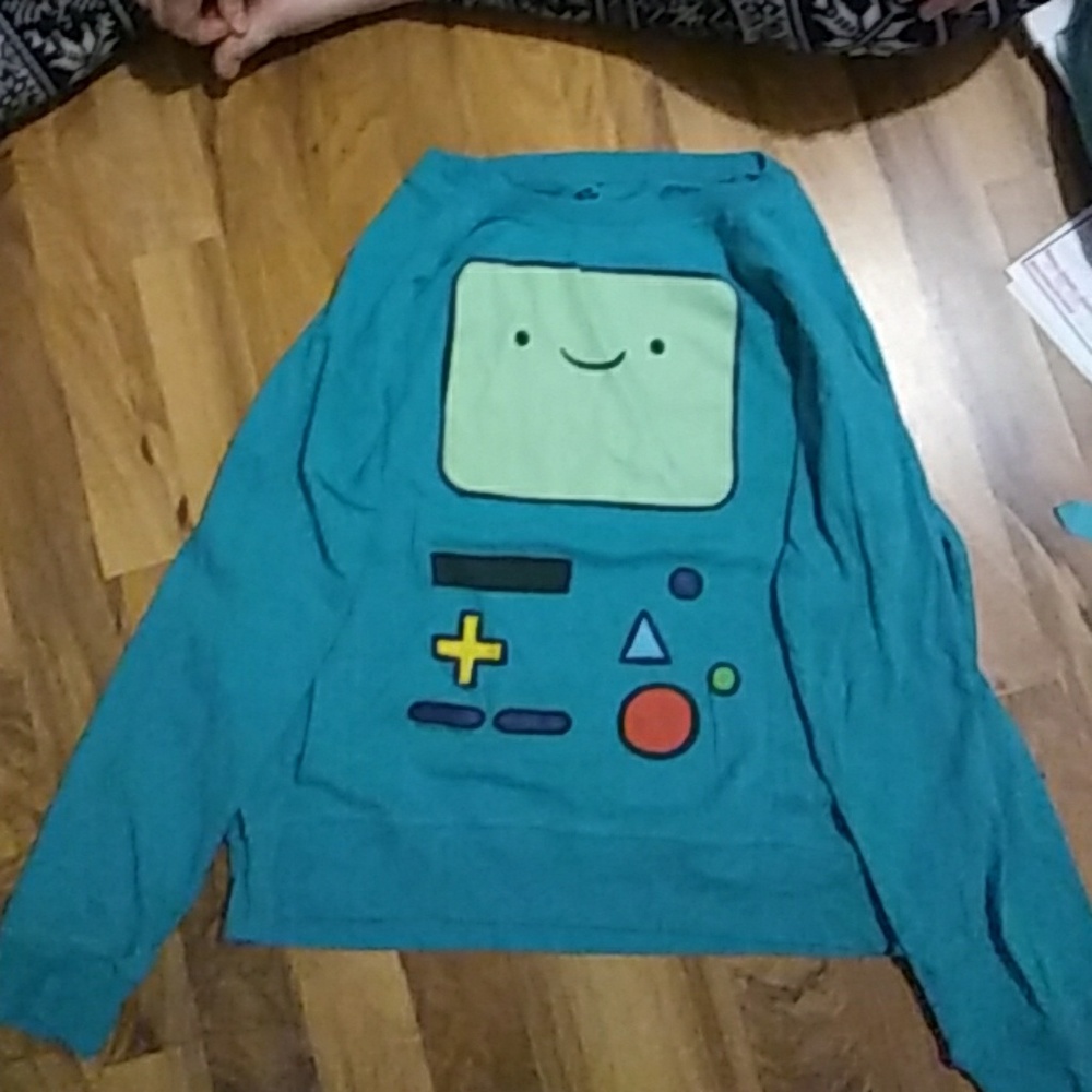 Two adventure time sweatshirts.